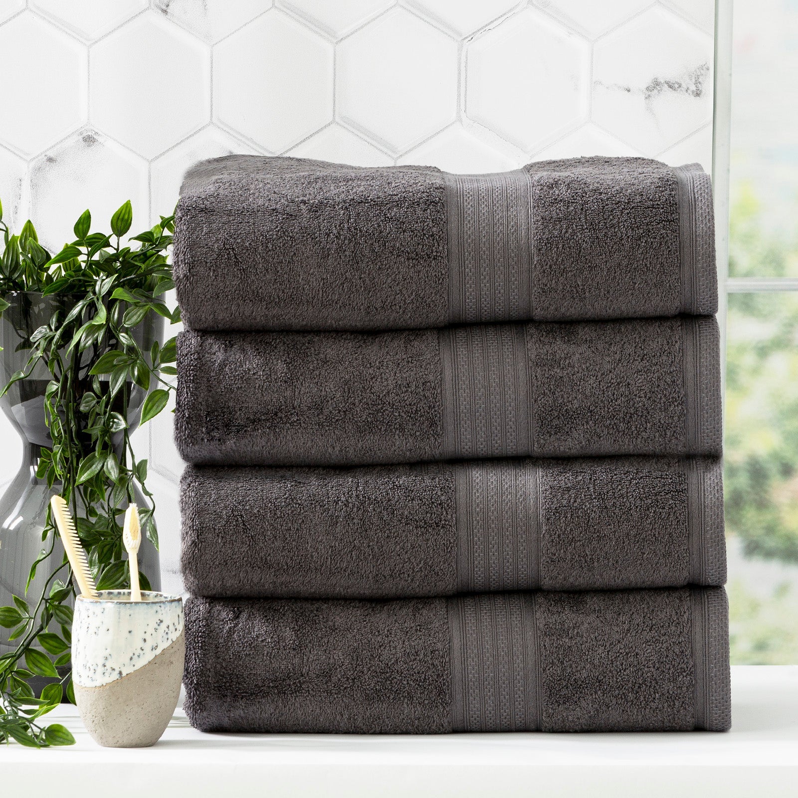 Charcoal grey bamboo cotton bath towel set neatly folded in a luxurious bathroom setting — view 5