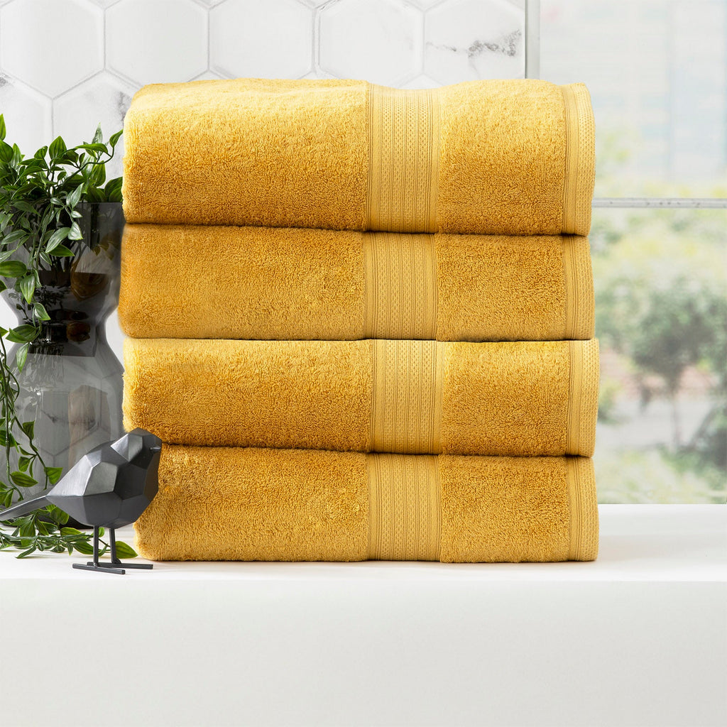 Stella mustard bamboo towel set folded, featuring plush yellow bamboo cotton fabric and woven details. — view 5