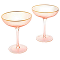 Set of two blush pink stemless coupe glasses with gold gilded rims and bubble design.