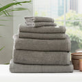 Folded stack of plush cobblestone ribbed platinum bath towels made from thick cotton yarn