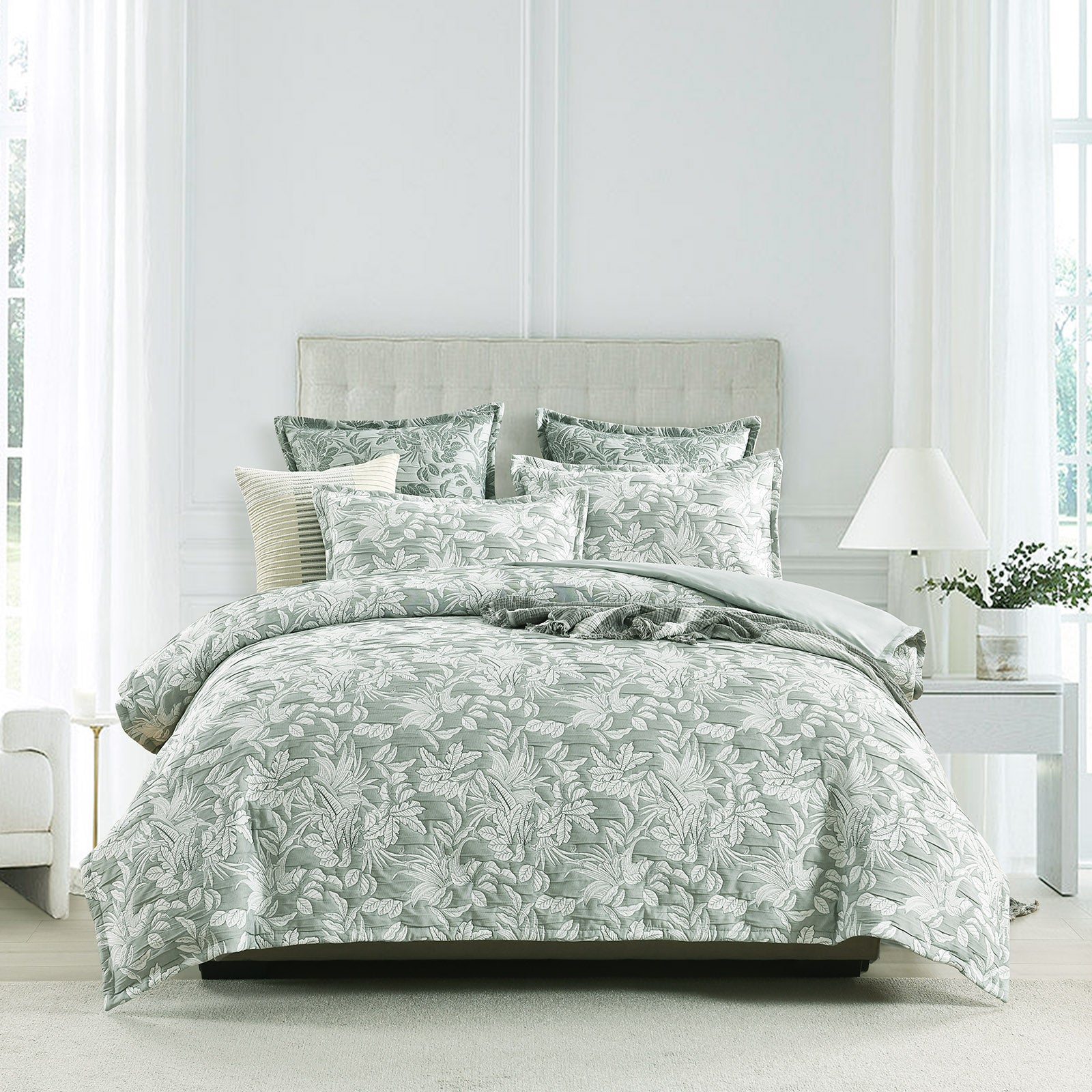 Green Indiana jacquard quilt cover set on a bed showing textured cotton matelasse weave