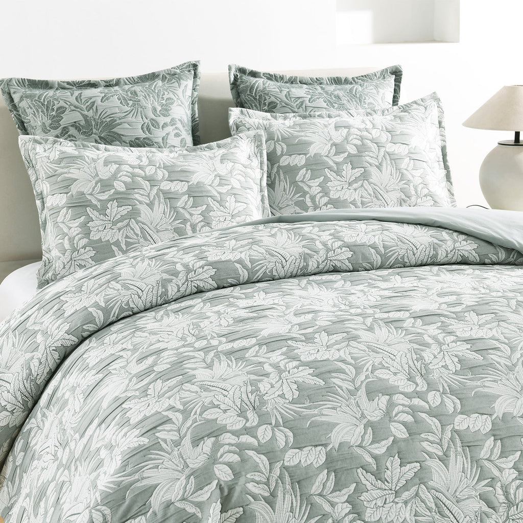 Green Indiana jacquard quilt cover set on a bed showing textured cotton matelasse weave — view 2