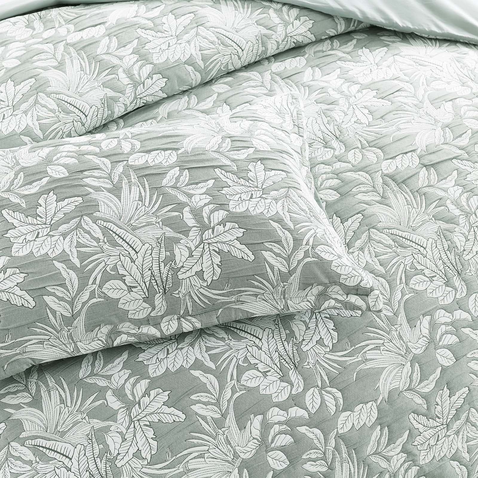 Green Indiana jacquard quilt cover set on a bed showing textured cotton matelasse weave — view 4