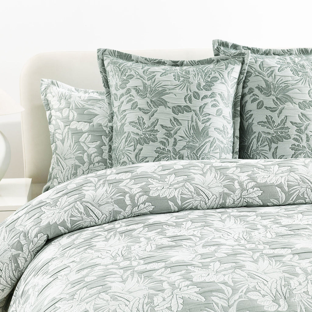 Green Indiana jacquard quilt cover set on a bed showing textured cotton matelasse weave — view 5