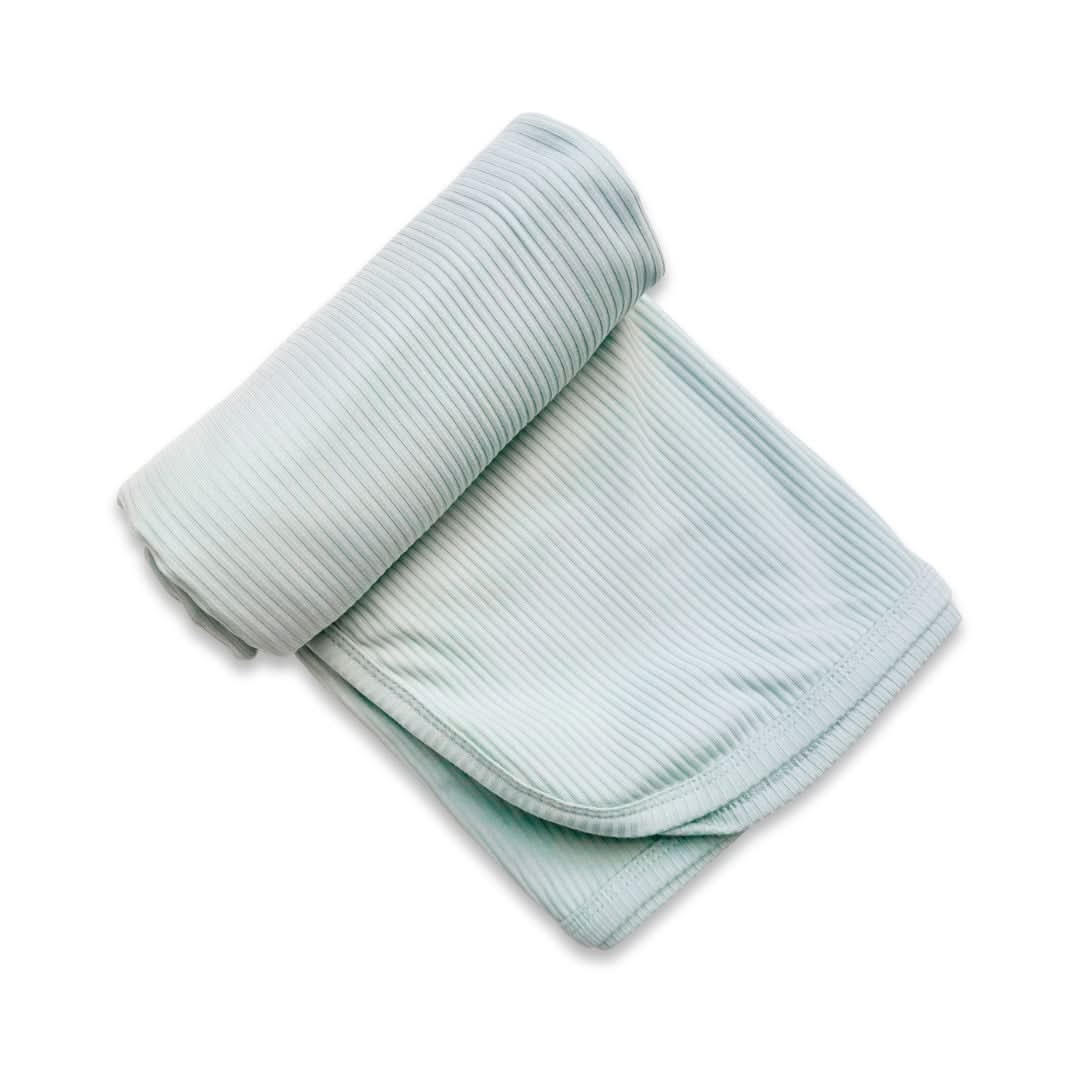 Baby bamboo swaddle blanket in solid rosewood pink folded to show the soft breathable knit fabric — view 3