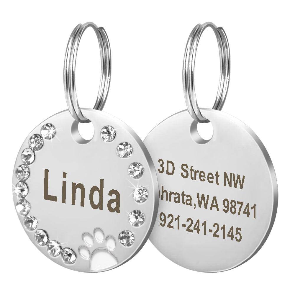 Personalized round metal dog tag keychain with custom engraving for pet owners and animal lovers