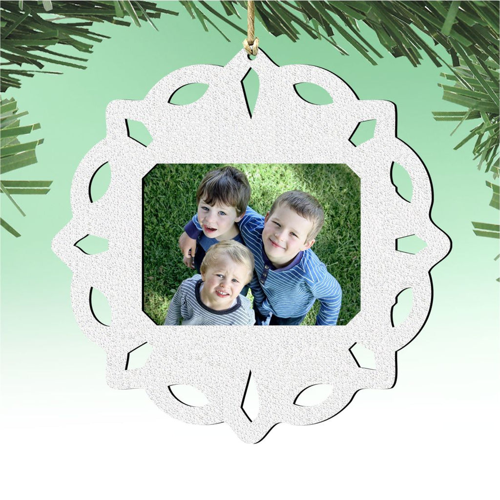 Wooden handcrafted snowflake Christmas tree ornament holding a small rectangular family photograph inside — view 5