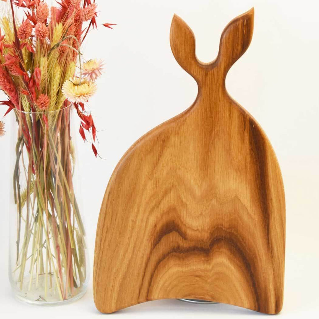 Handcrafted oak cutting board displaying natural wood grain on a clean kitchen countertop. — view 4