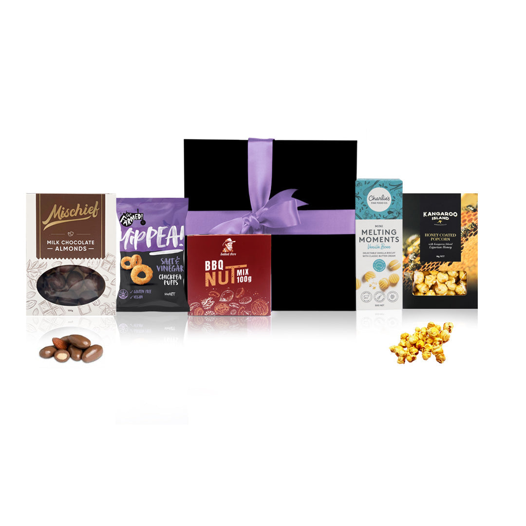 Mini Australian gourmet snack hamper in a black gift box with purple ribbon and sweet treats.