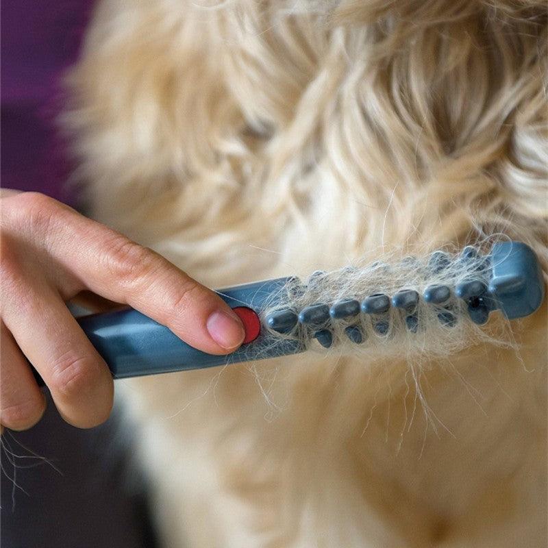 Electric pet comb grooming tool with ergonomic handle and hidden rotating safety blades for detangling. — view 3