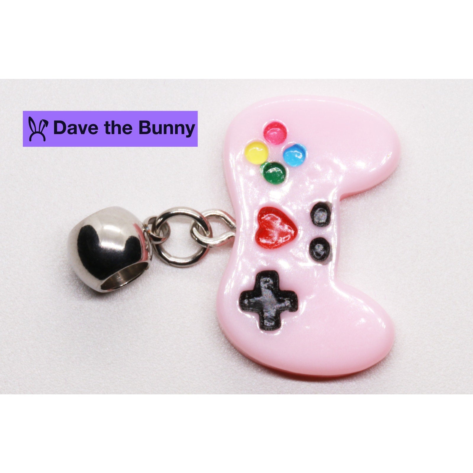 Pink game controller pendant necklace with colorful buttons on silver chain with purple gift pouch — view 5