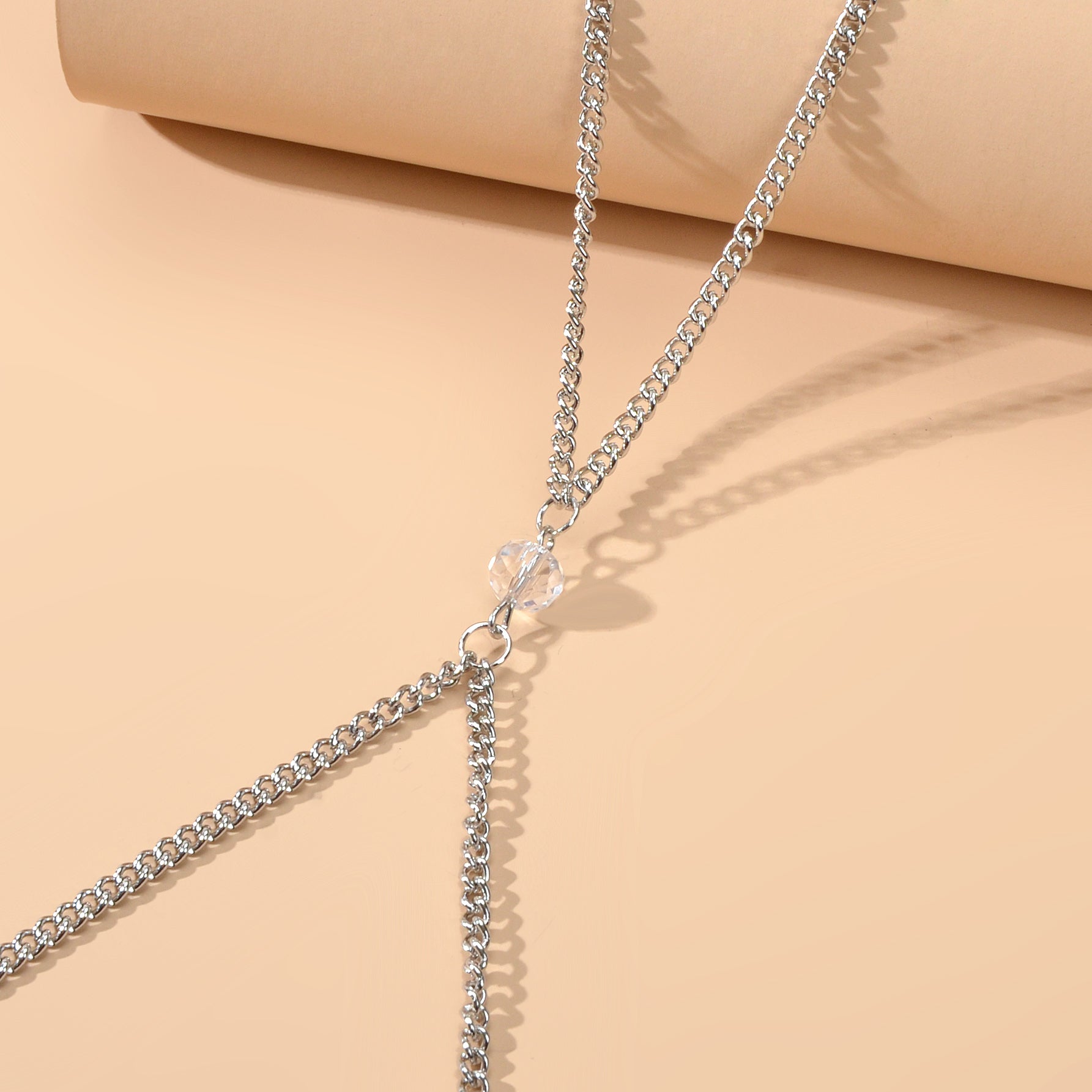 Silver-tone layered chest and belly body chain harness displayed for beach and festival fashion styling. — view 3