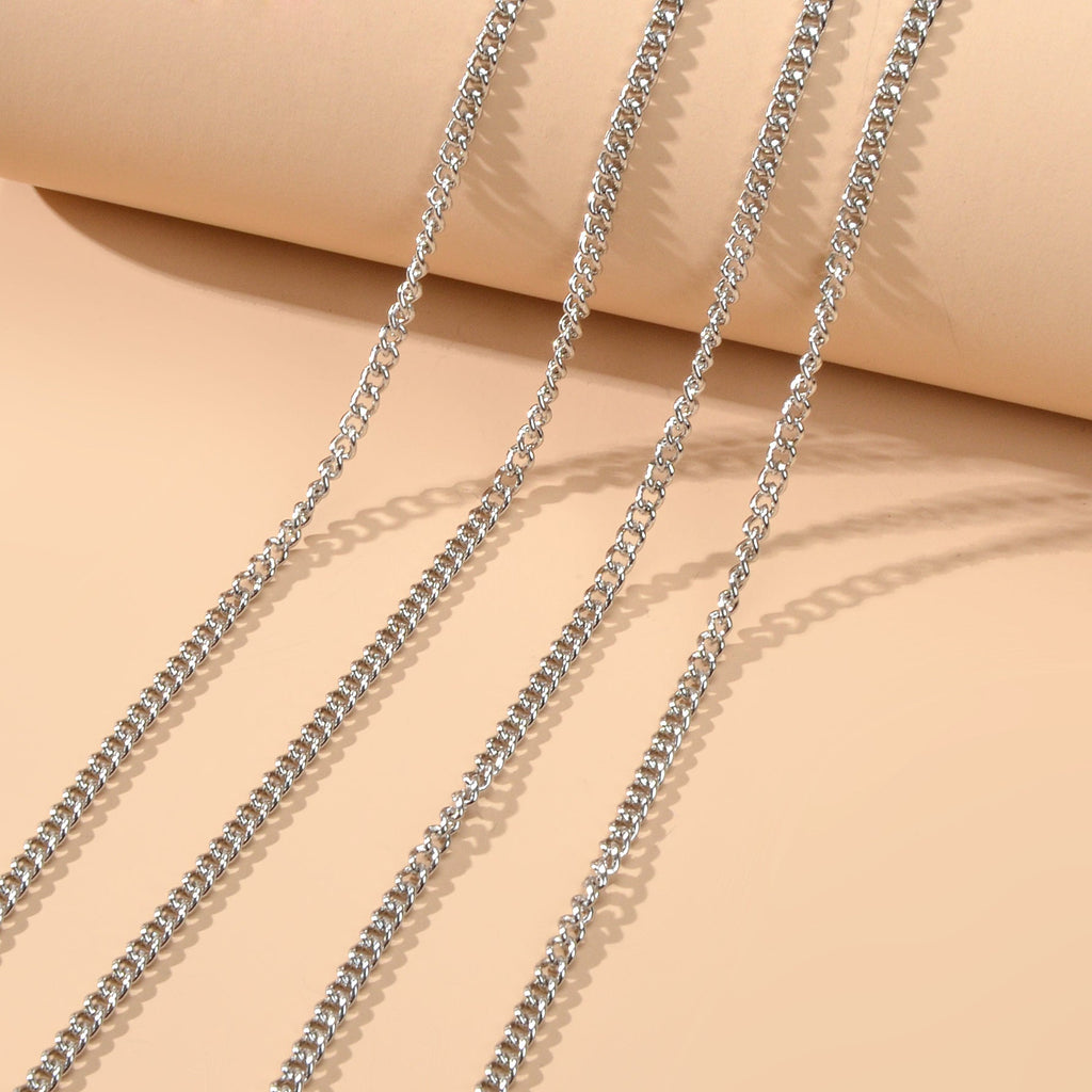 Silver-tone layered chest and belly body chain harness displayed for beach and festival fashion styling. — view 4