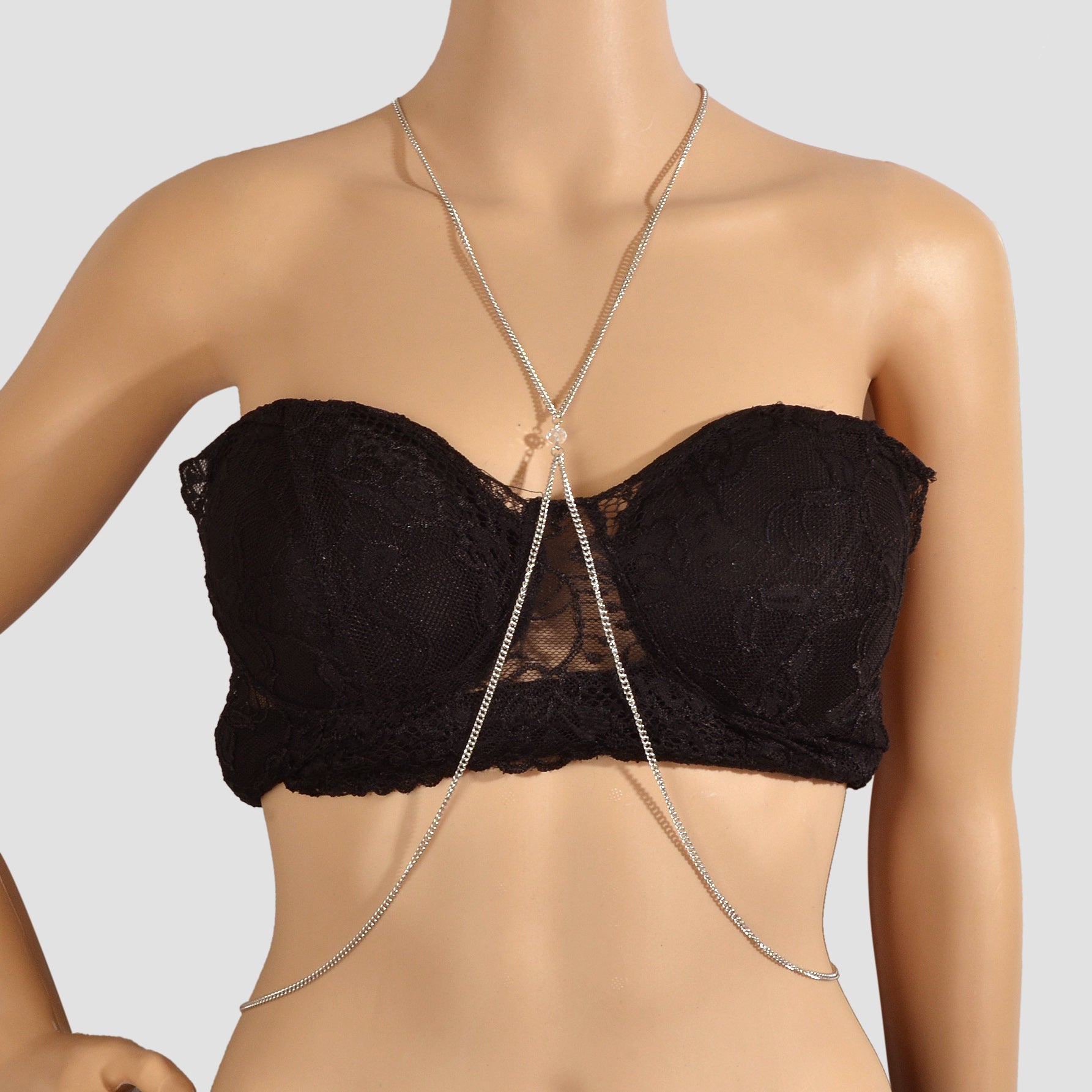 Silver-tone layered chest and belly body chain harness displayed for beach and festival fashion styling.