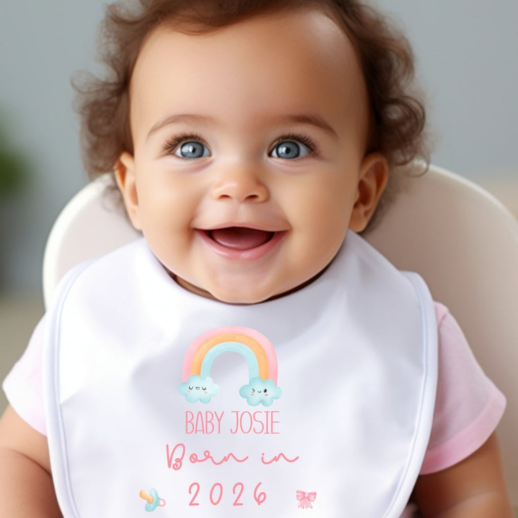 Personalised born in 2026 rainbow baby outfit featuring custom name printed on soft white fabric