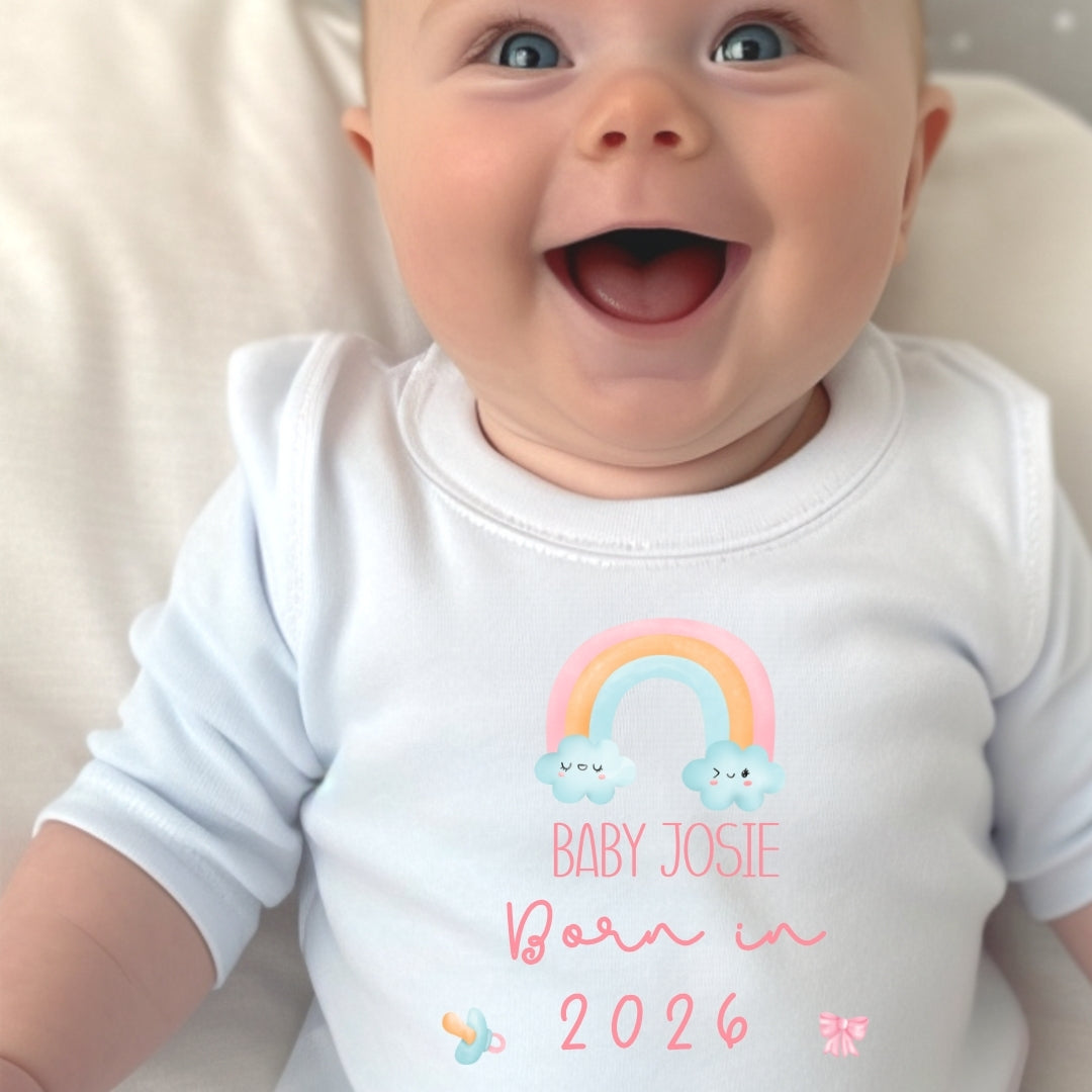 Personalised born in 2026 rainbow baby outfit featuring custom name printed on soft white fabric — view 2