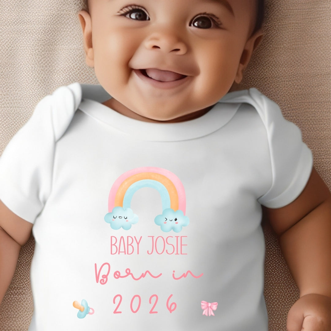 Personalised born in 2026 rainbow baby outfit featuring custom name printed on soft white fabric — view 3