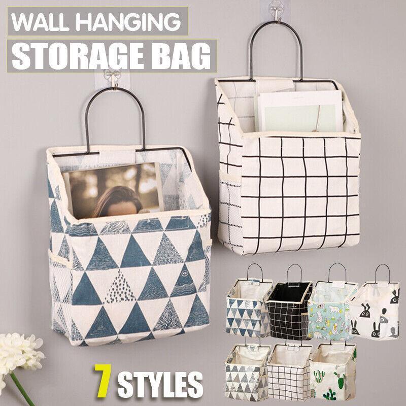 Canvas wall hanging storage bag with side pockets and steel frame hook for home organisation