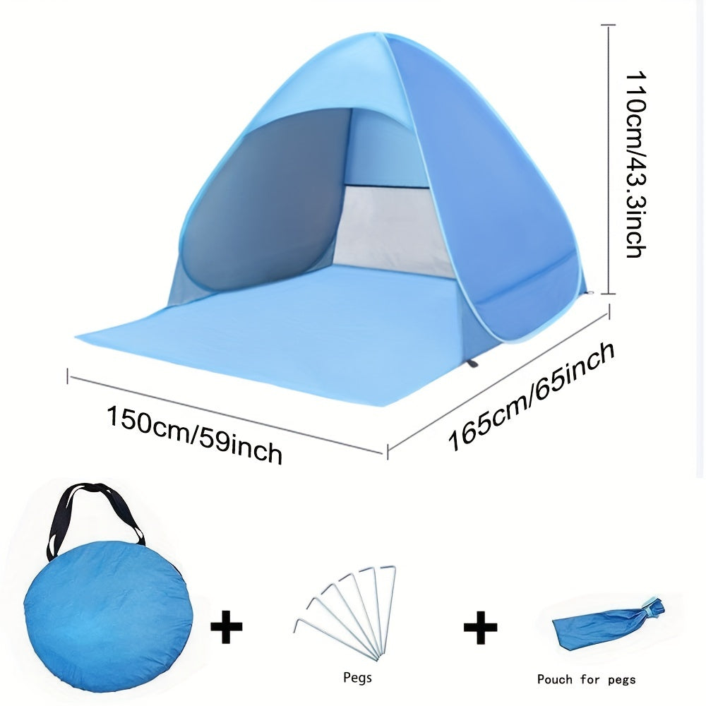 Portable waterproof beach tent in blue with sunshade pitched outdoors on sand — view 3