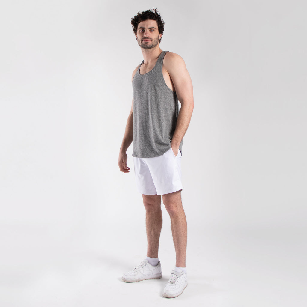 Men's seven-inch white athletic shorts with elastic waistband and side pockets made of lightweight nylon — view 2