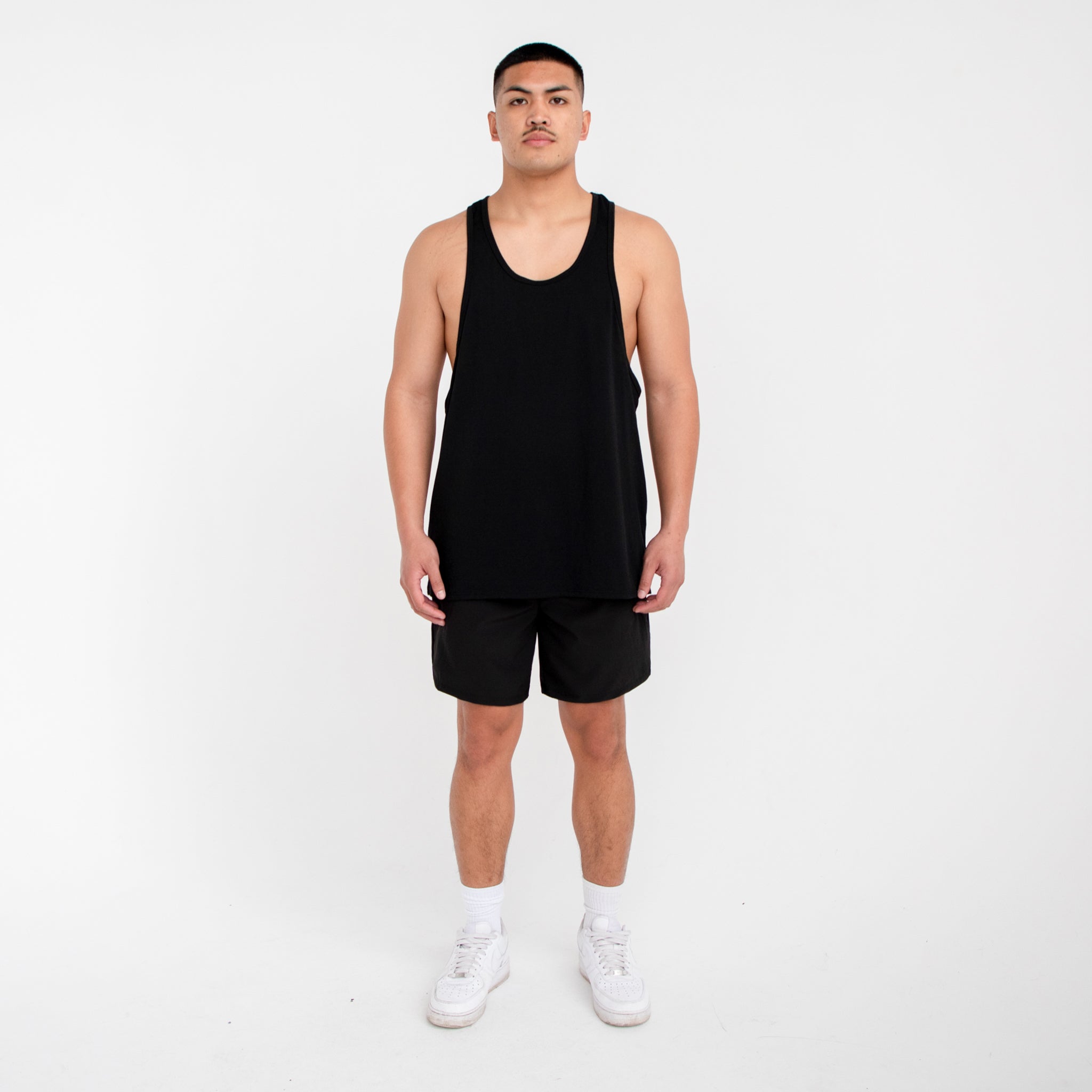 Men's seven-inch white athletic shorts with elastic waistband and side pockets made of lightweight nylon — view 5