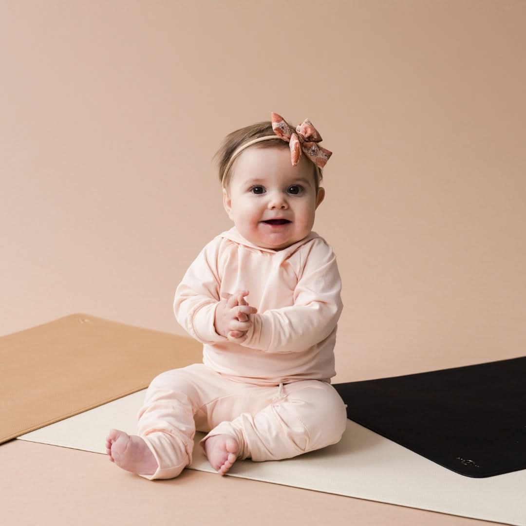 Ivory vegan leather changing mat laid flat, soft wipeable surface for baby diaper changes — view 3