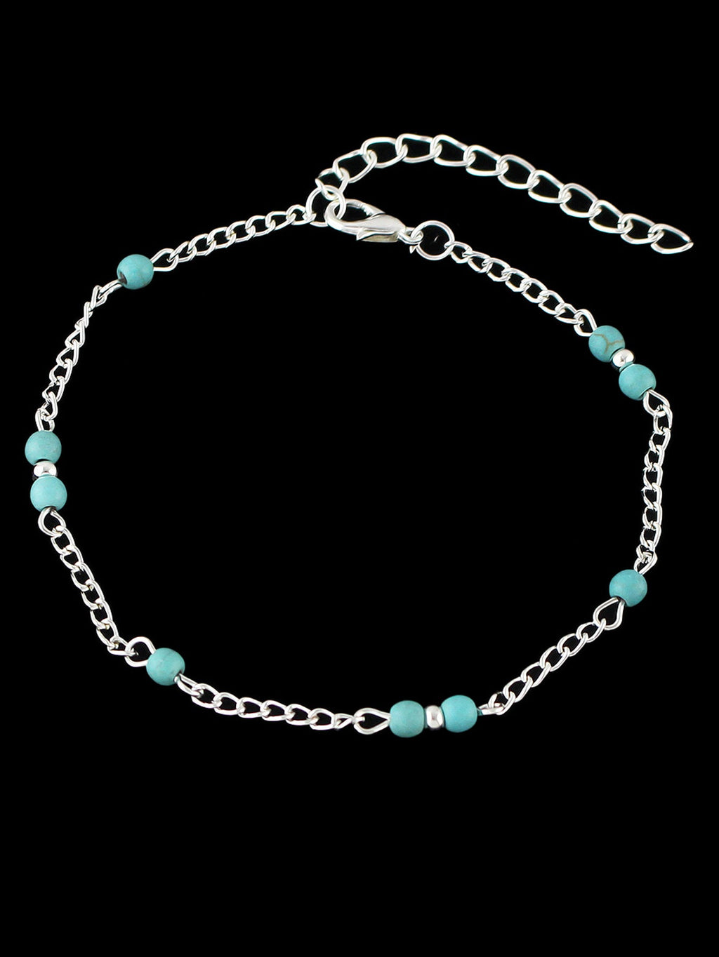 Boho chic turquoise barefoot sandal anklet with delicate silver chains draped gracefully over a foot — view 2