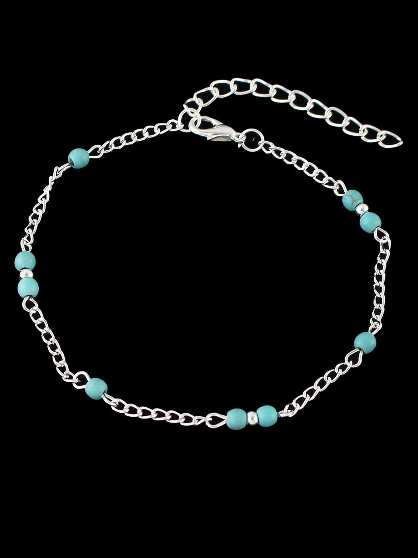 Boho chic turquoise barefoot sandal anklet with delicate silver chains draped gracefully over a foot — view 2