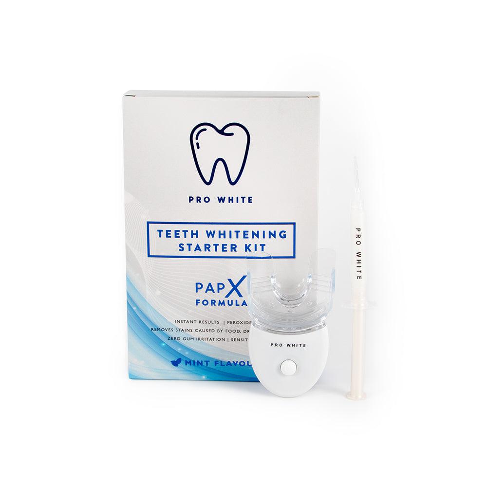 Starter PAP-X teeth whitening kit with LED light, mouth tray, and gel syringe.