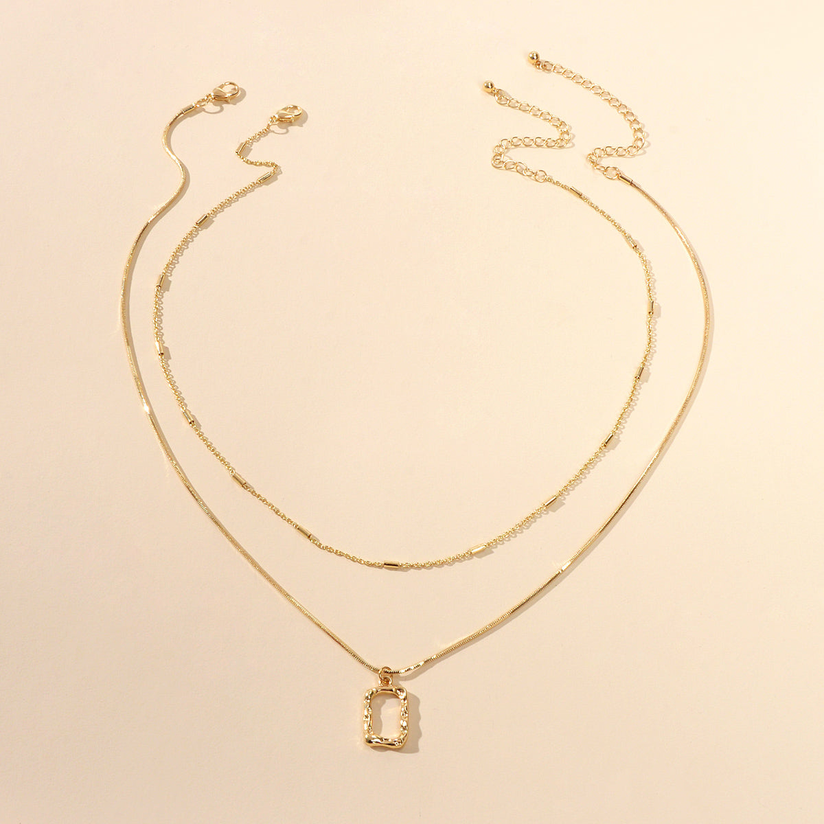 Minimalist square pendant layered necklace set with adjustable chain in metallic gold and silver finish — view 2