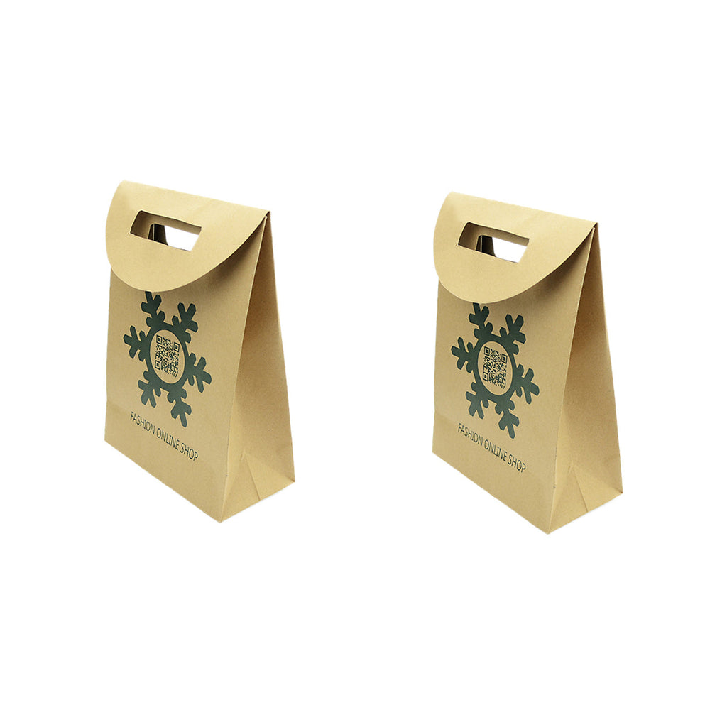Two large brown kraft paper Christmas gift bags featuring a festive holiday pattern and handles — view 3