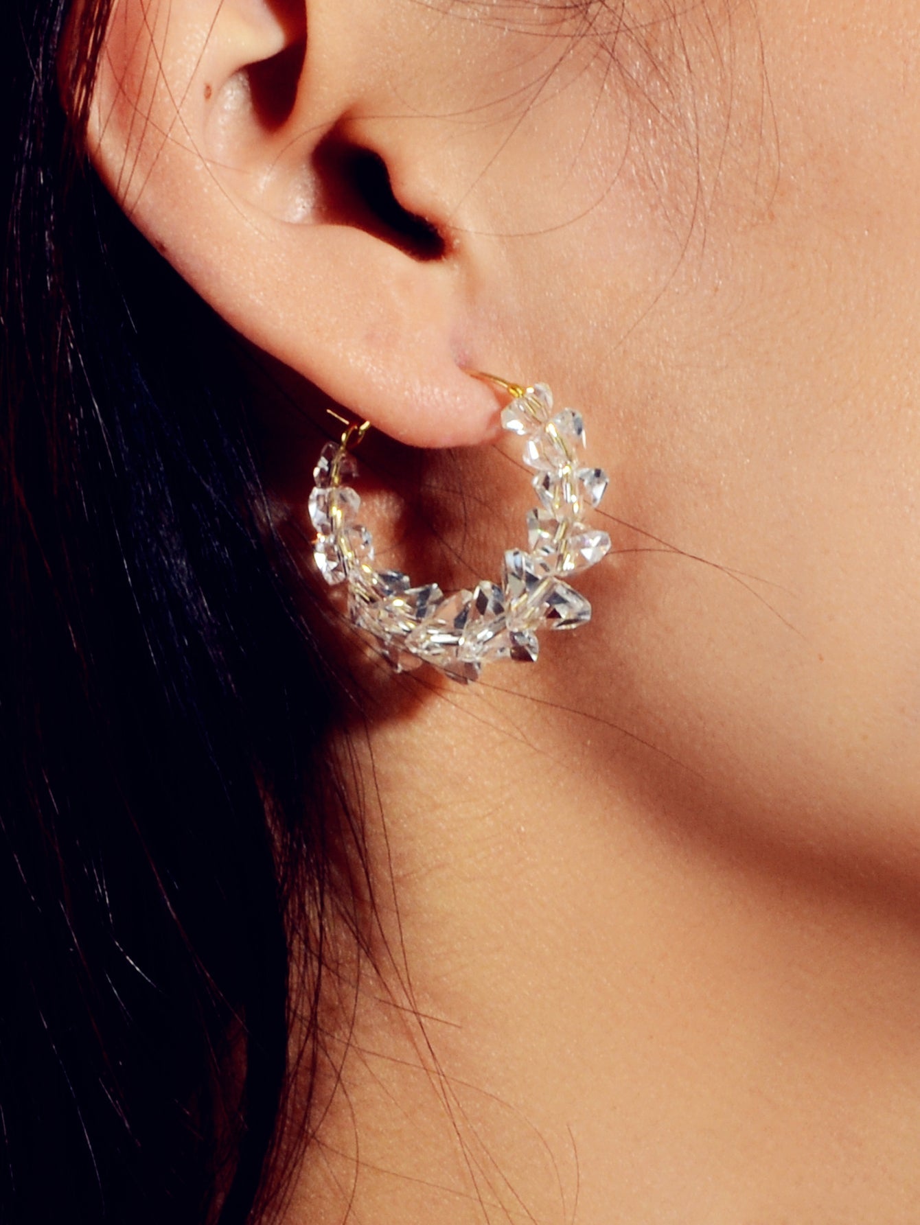 Transparent acrylic bead hoop dangle earrings for women on a clean background. — view 2