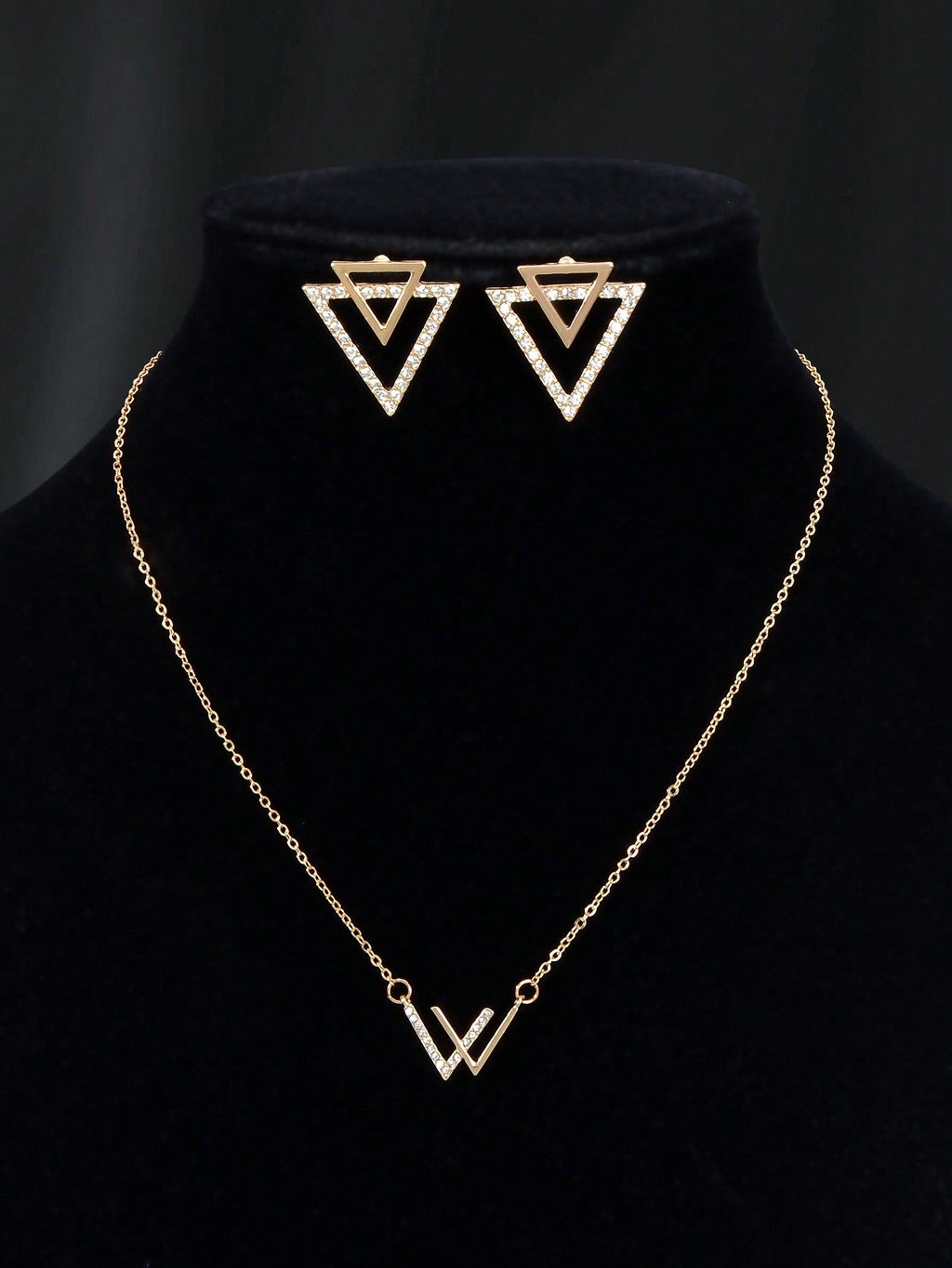 Double V pendant necklace and matching triangle earrings set featuring polished metallic geometric design. — view 3