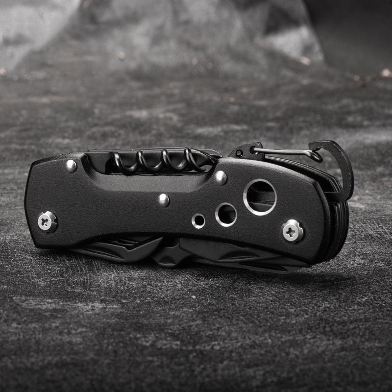 Mysterious black folding multi-tool pocket knife with stainless steel blades and outdoor survival tools. — view 2