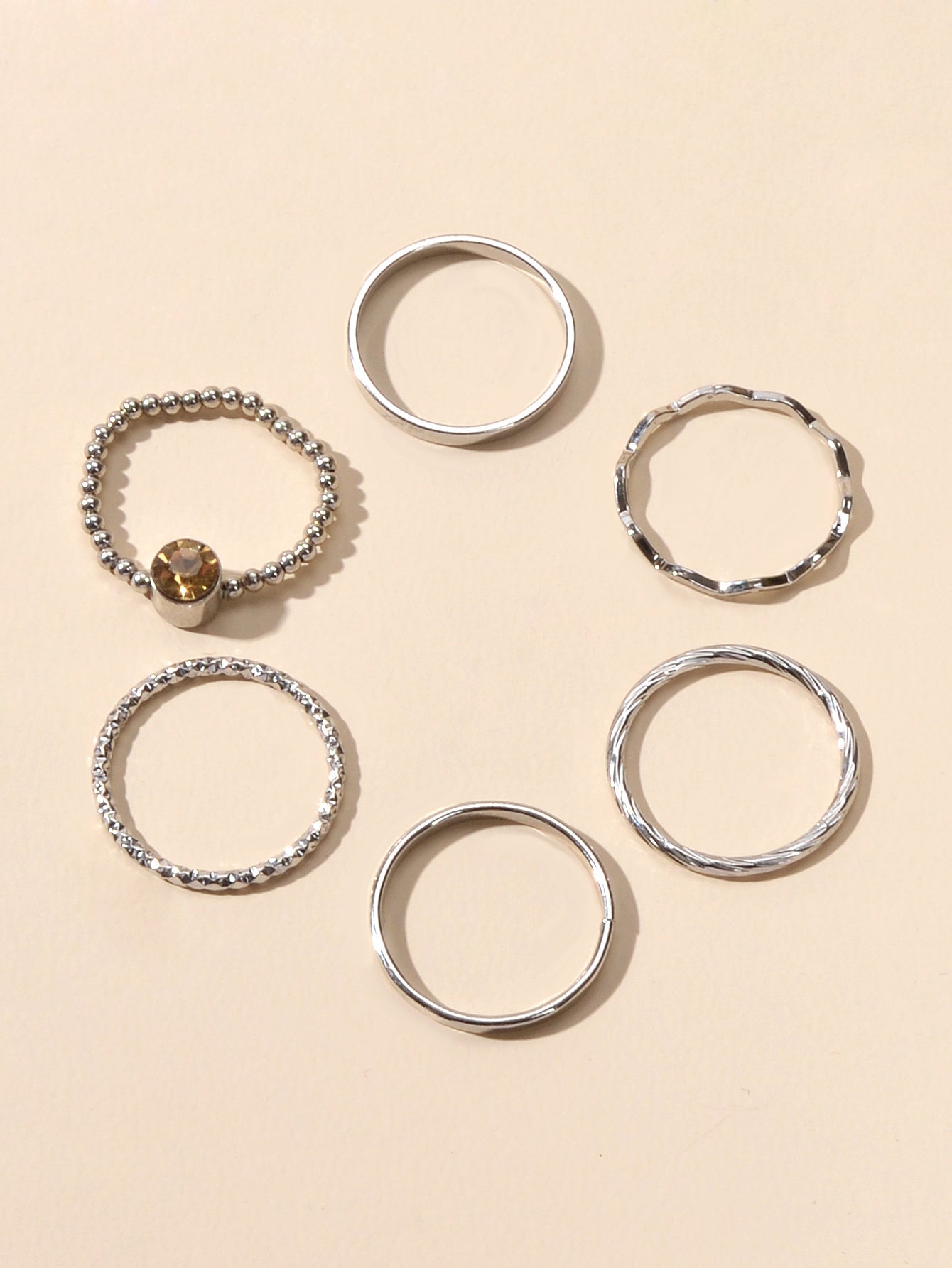 Six piece stackable silver tone rhinestone ring set in assorted sizes for women