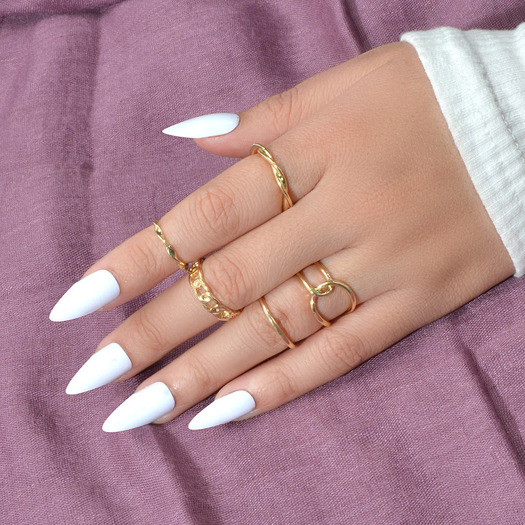 Set of five minimalist stackable midi finger rings in trendy gold and silver finishes — view 5
