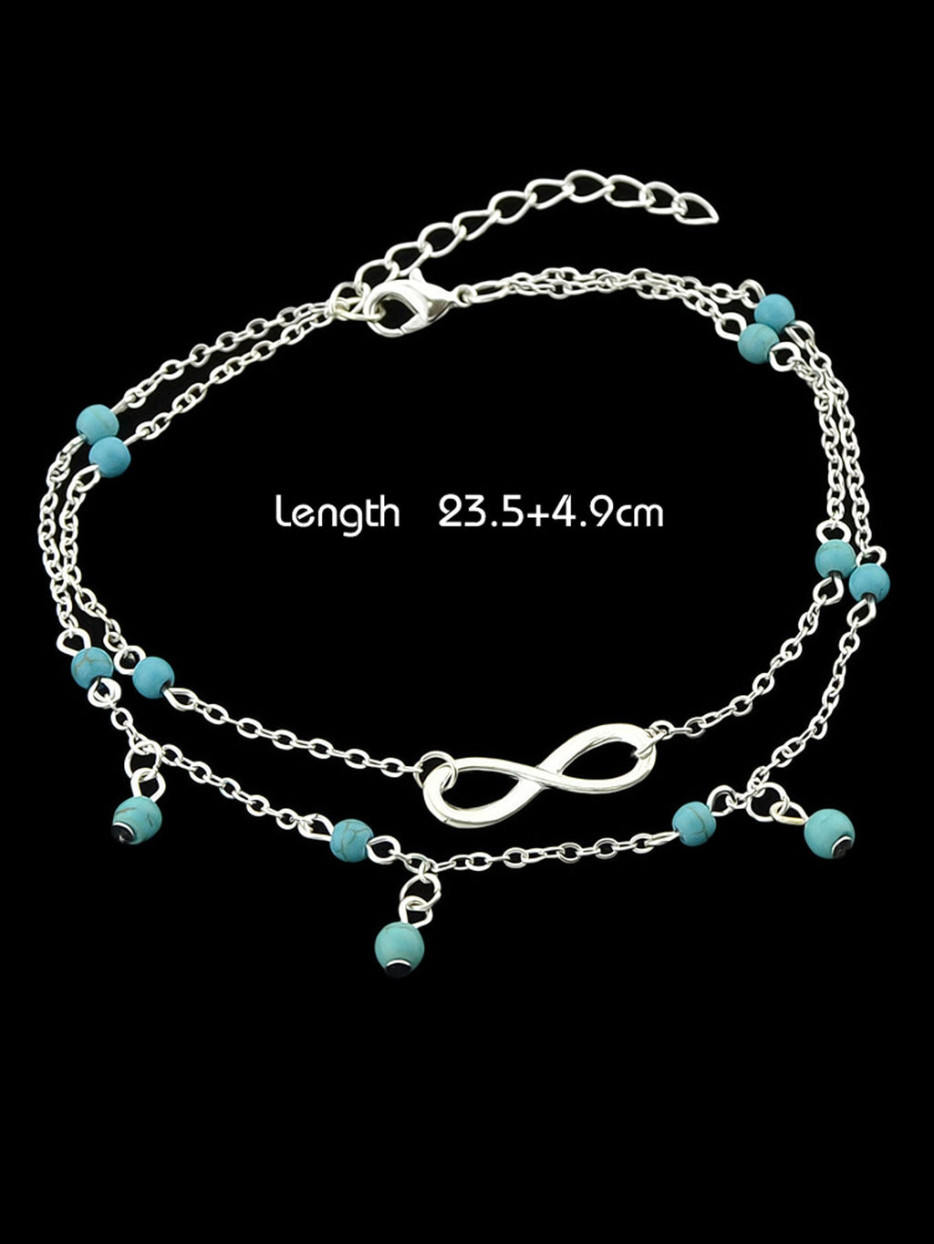 Turquoise infinity anklet with double layer silver chain worn on a bare foot. — view 2