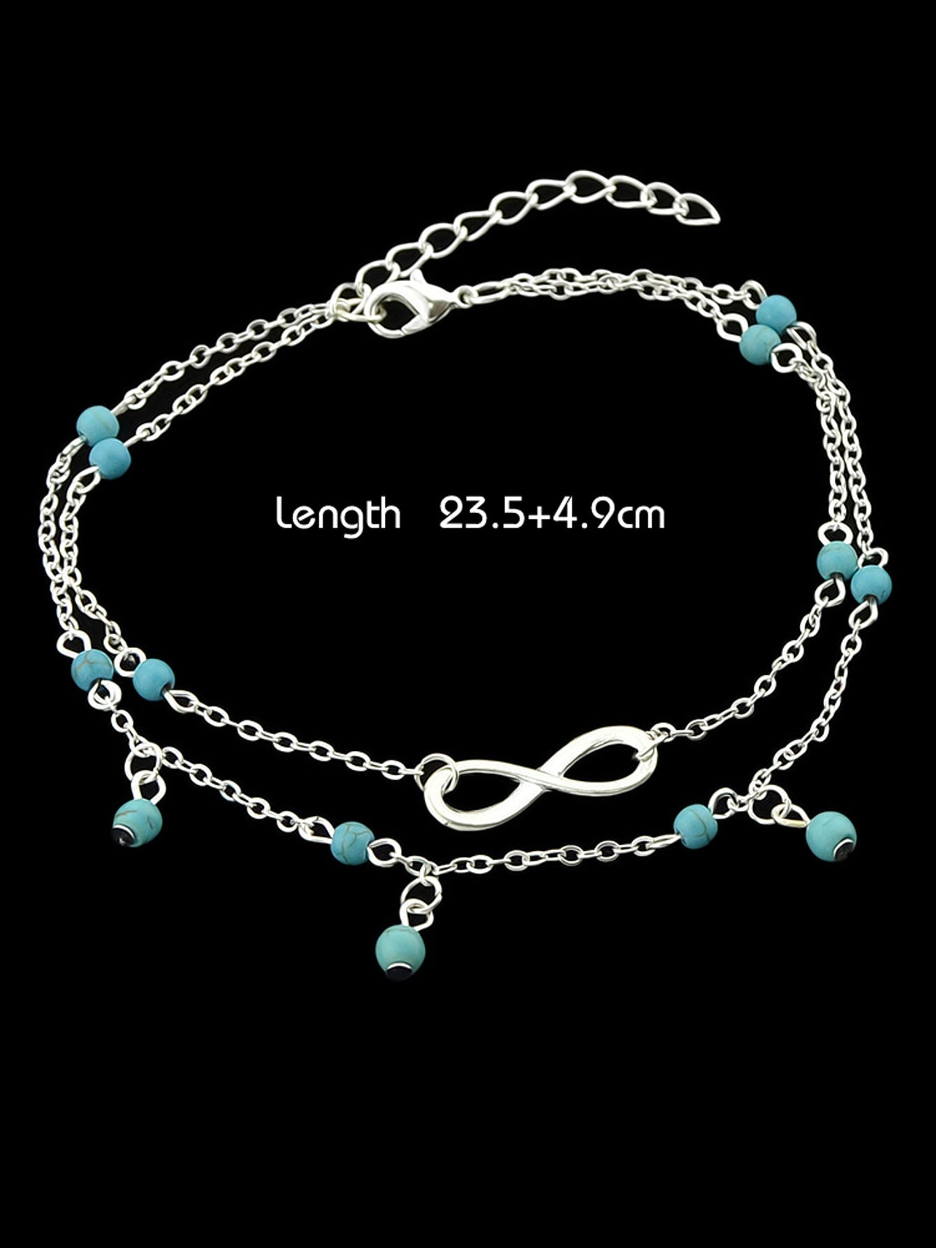 Turquoise infinity anklet with double layer silver chain worn on a bare foot. — view 2