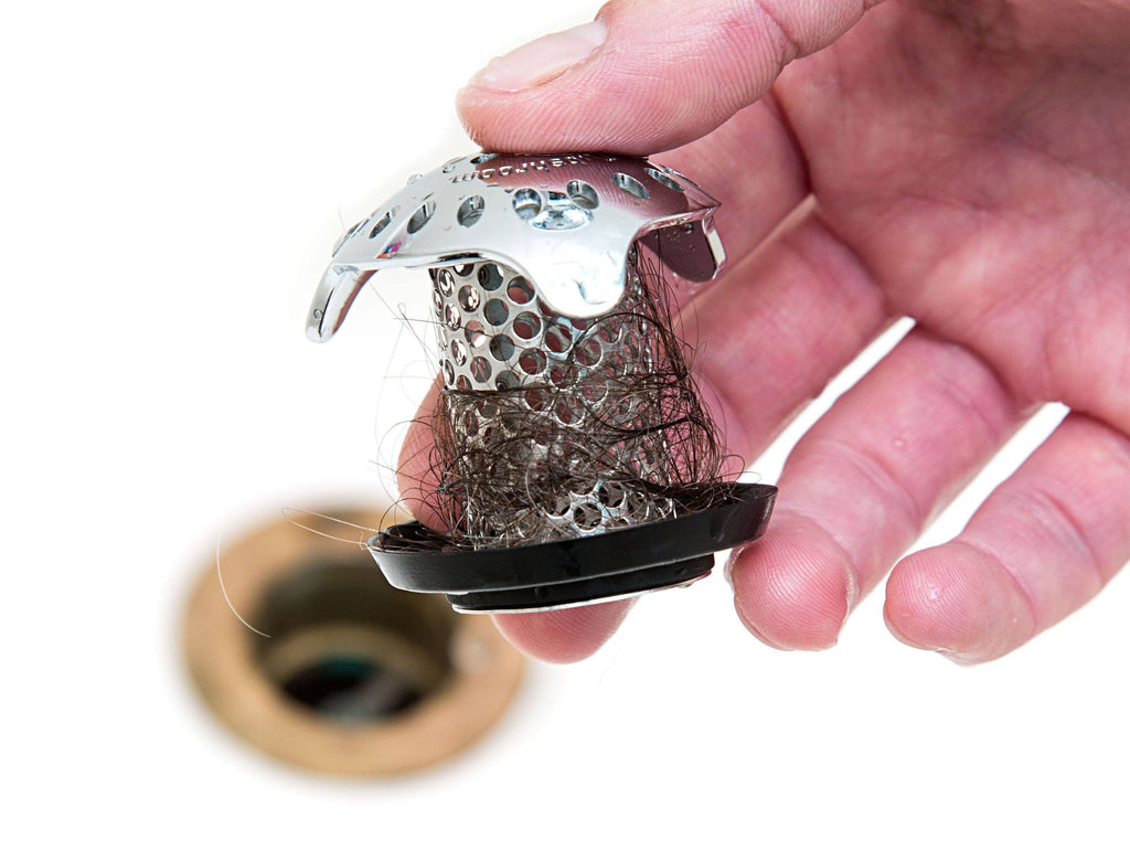 Stainless steel TubShroom Ultra bathtub hair catcher with StopShroom drain plug and sizing adapters — view 2