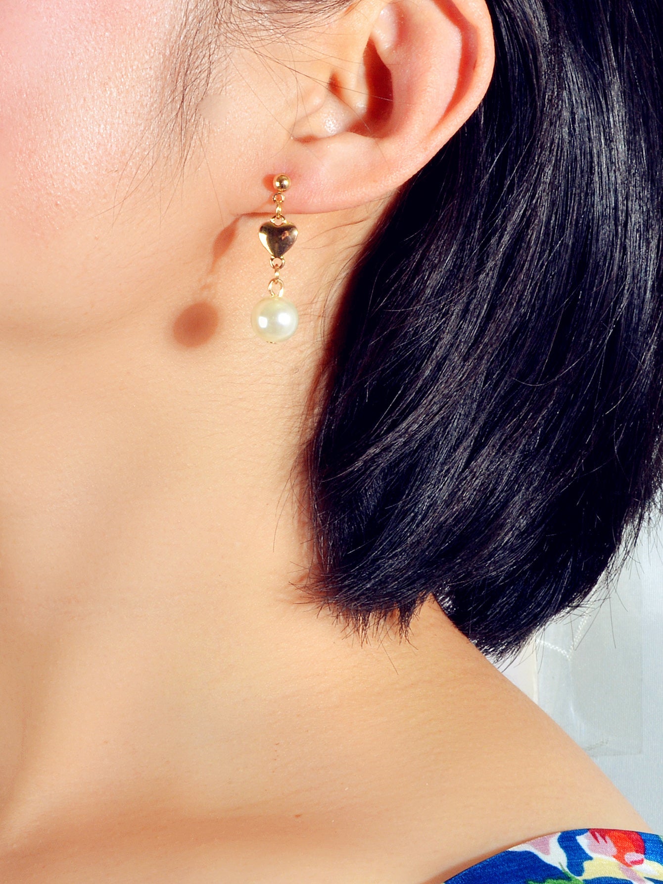 Gold heart drop earrings with simulated pearls for weddings and anniversaries on a white background — view 2