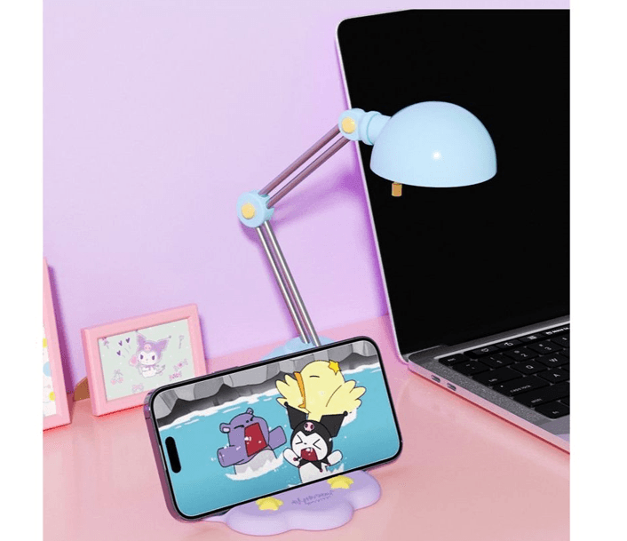 Cute Sanrio character desktop phone stand cradle featuring Kuromi and Cinnamoroll holding a smartphone securely — view 4