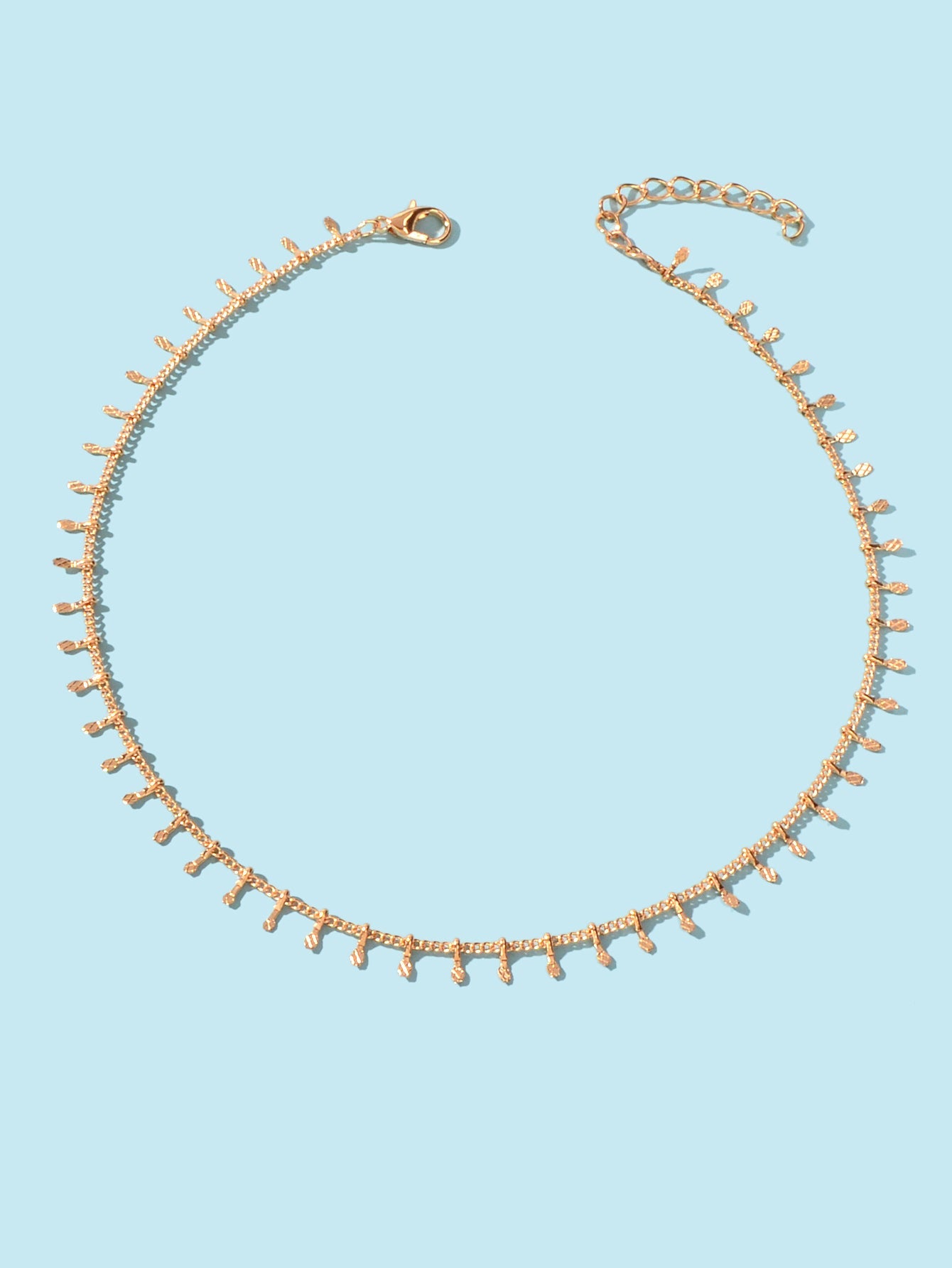 Dainty gold charm choker necklace on a delicate short chain for minimalist everyday fashion. — view 2