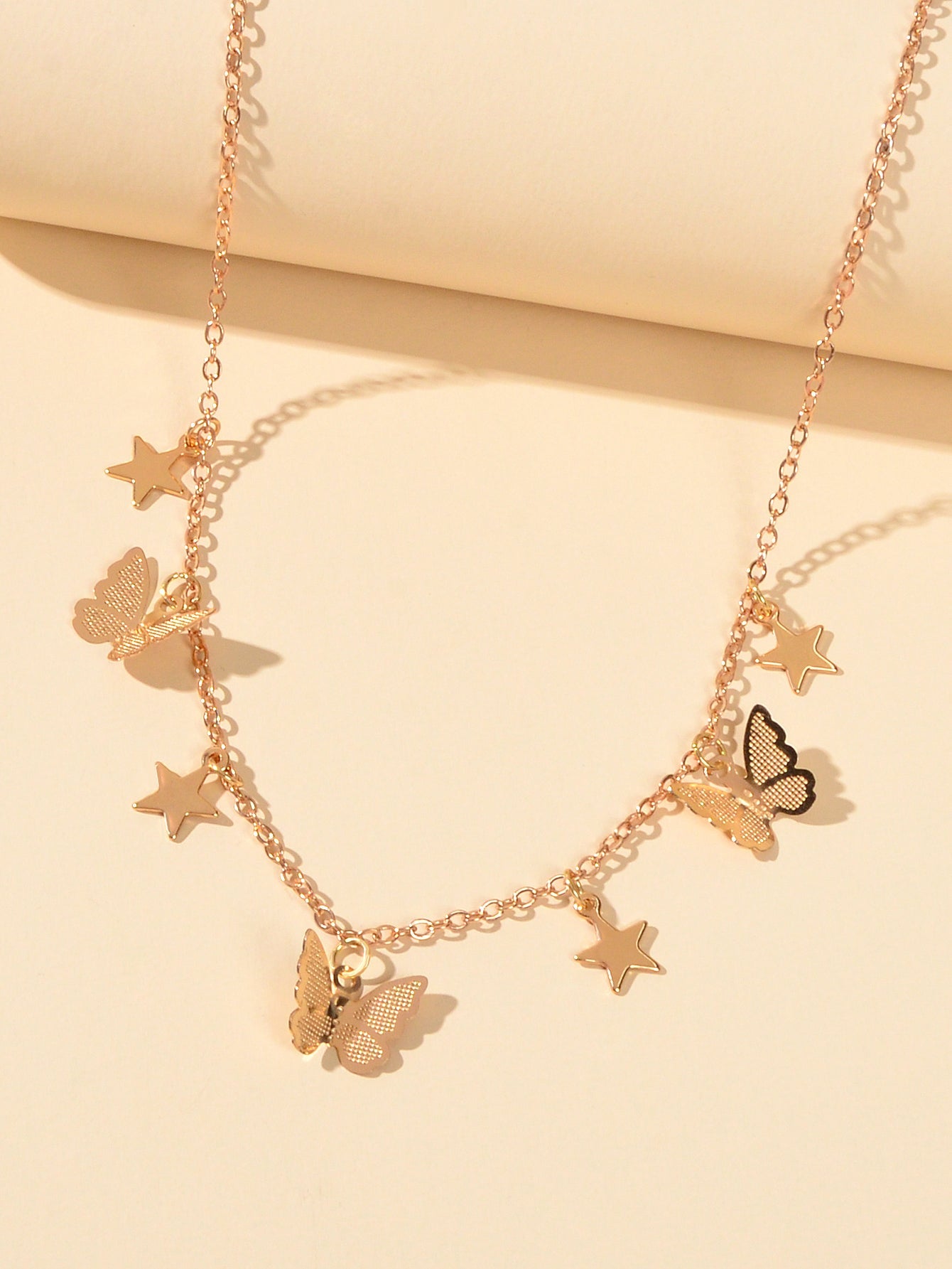 Gold chain collar necklace with delicate star and butterfly charms for women's party wear — view 2