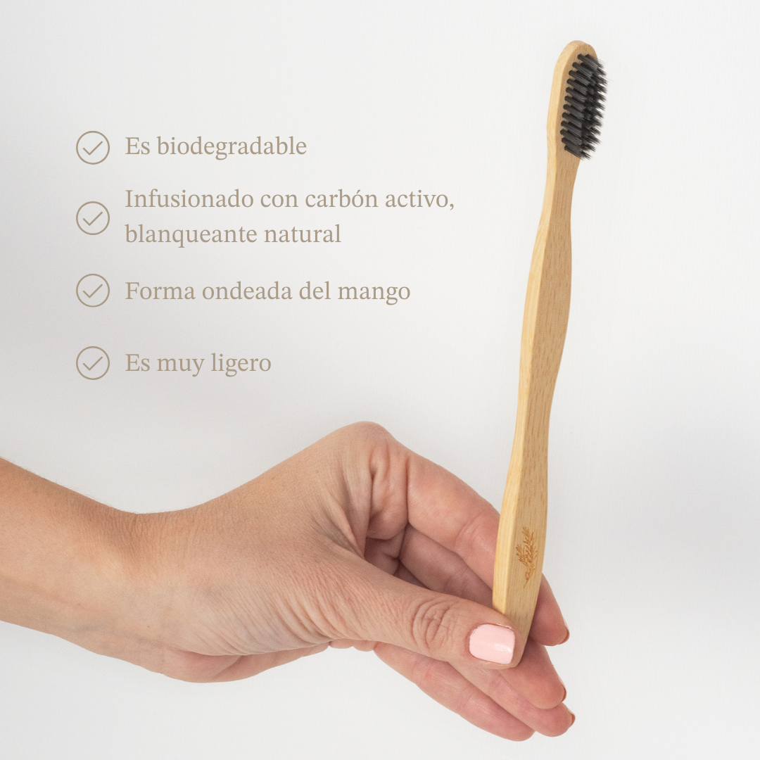 Eco-friendly bamboo toothbrush with soft whitening bristles and a natural wooden handle — view 3