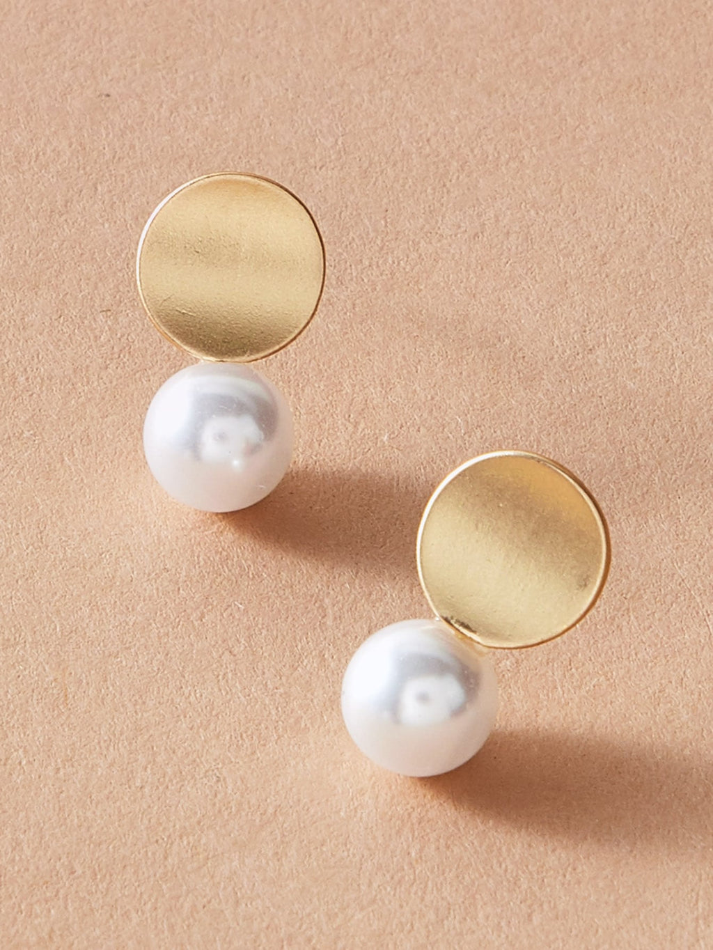 Dainty round gold metal faux pearl stud earrings for daily wear and elegant occasions. — view 2