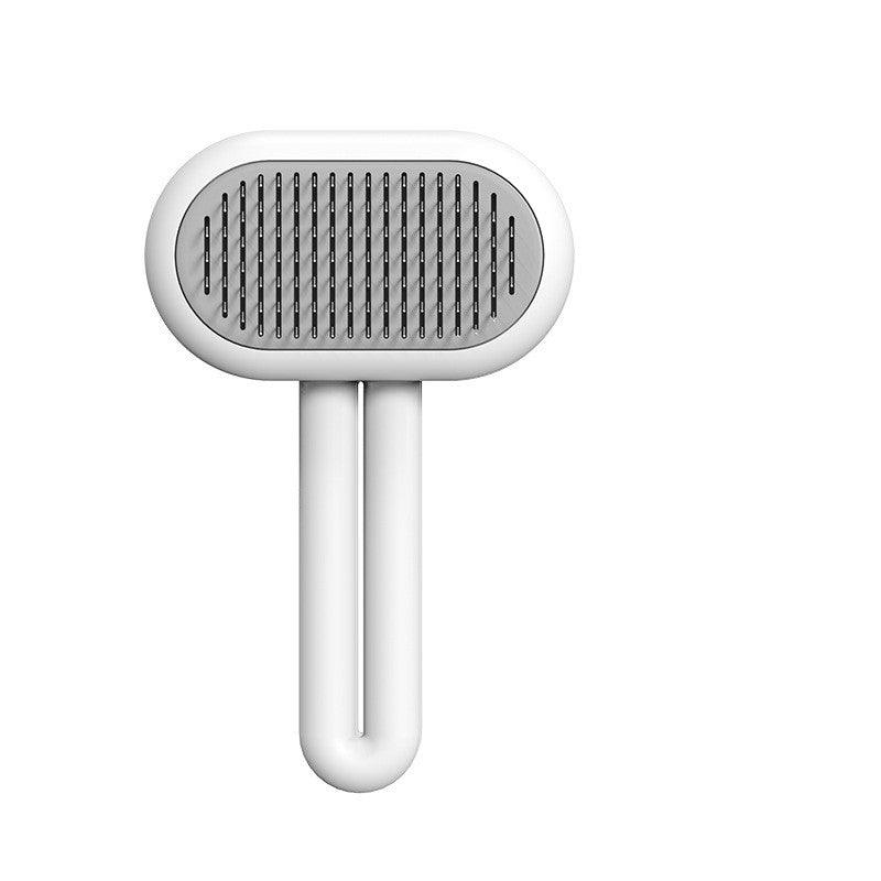 Ergonomic pet grooming comb with stainless steel bristles and a sleek capsule shape handle — view 2