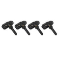Four black automotive tyre pressure monitoring sensors arranged on a clean white background