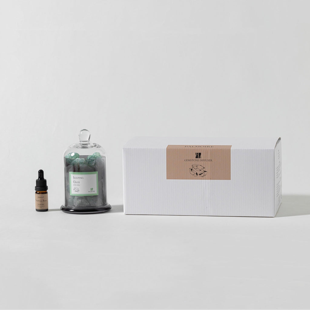 Sleeping Oasis gemstone diffuser with natural stones and Tropical Bath fragrance oil bottle. — view 5