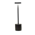 Minimalist wireless touch table lamp in polished aluminum on a bedside table