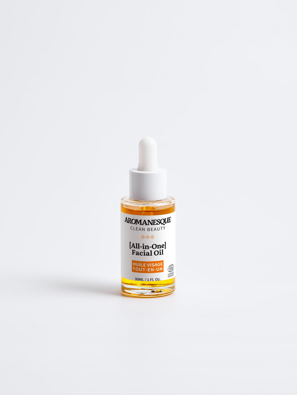 Aromanesque all-in-one facial oil in a minimalist white bottle for hydrating dry and mature skin — view 4